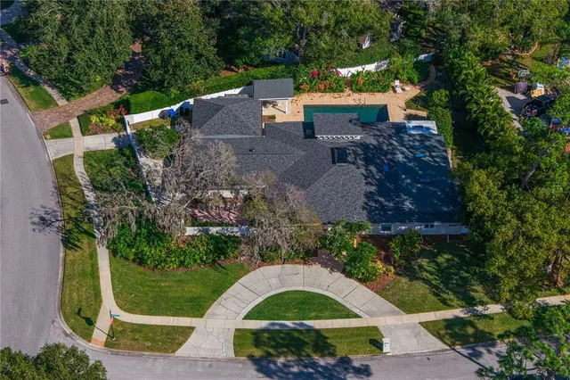 an aerial view of a house with a garden