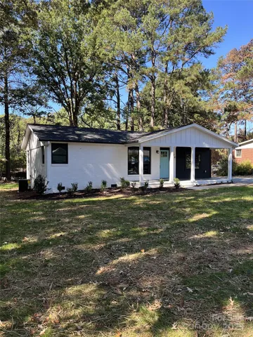 a house with a tree in front of it