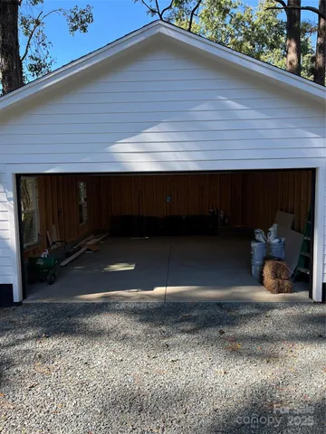 a front view of house with outdoor space and garden