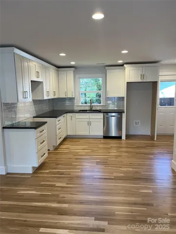 a bathroom with a double vanity sink and mirror