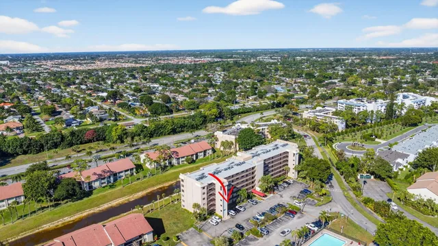 a view of swimming pool with outdoor seating and plants
