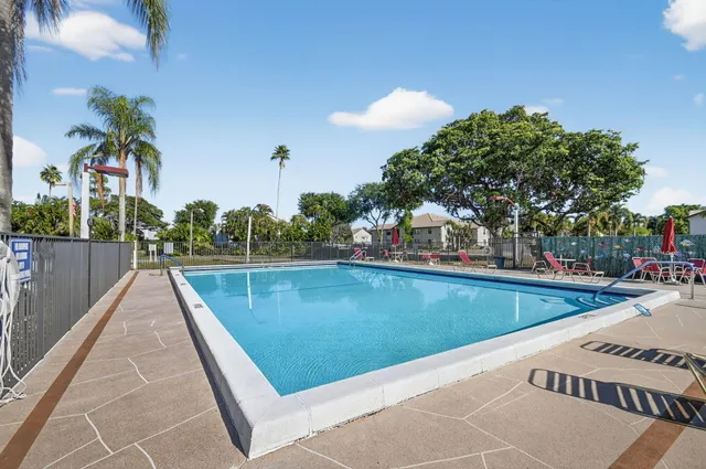 a view of building with outdoor space and swimming pool