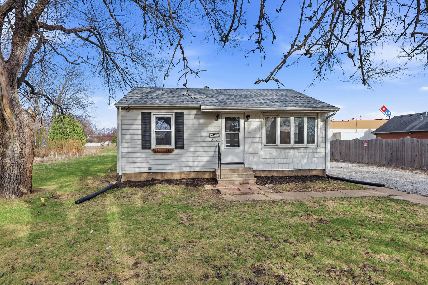 a view of a house with a yard