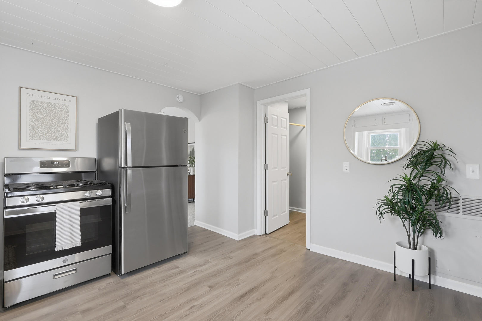 4120 4th Street East Moline, IL 61244 - Photo 11 of 24 a kitchen with appliances a refrigerator and a wooden floor