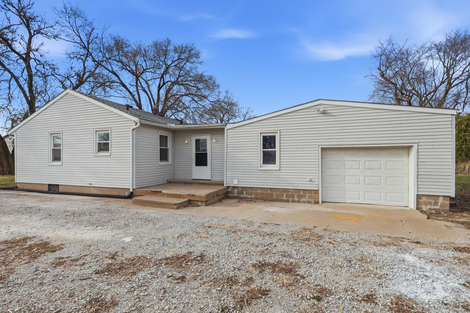 4120 4th Street East Moline, IL 61244 - Photo 2 of 24 a view of a house with a yard and garage