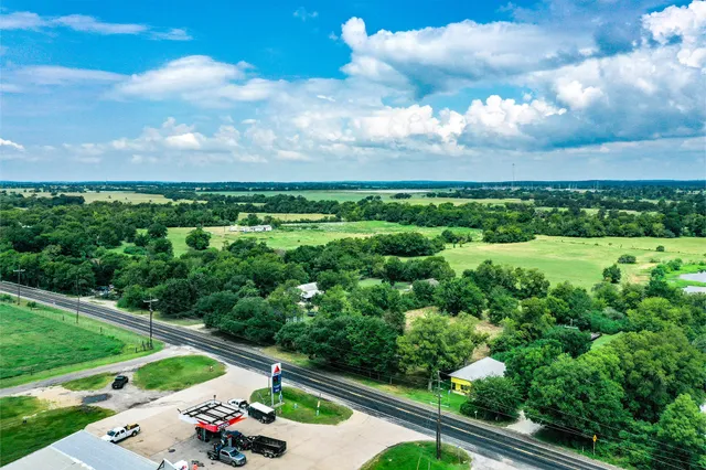 a view of a city with lush green forest