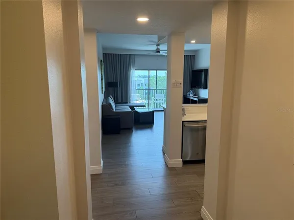 a view of living room with furniture and a window
