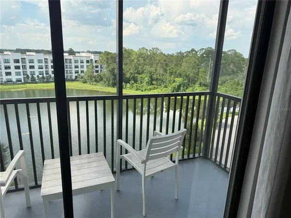 a view of a balcony with chairs