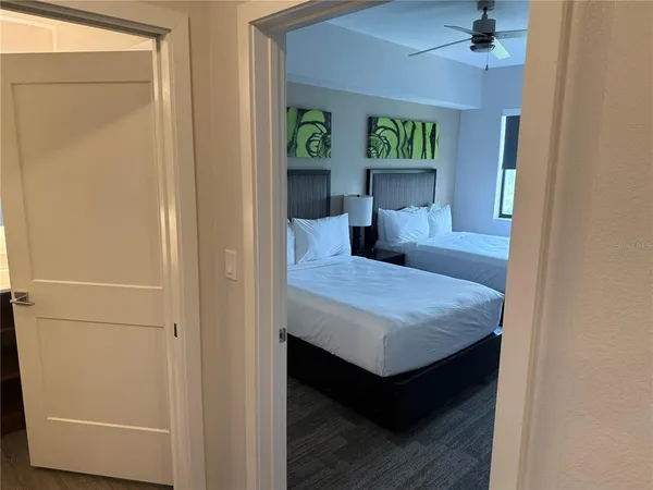 a bedroom with a bed and a table