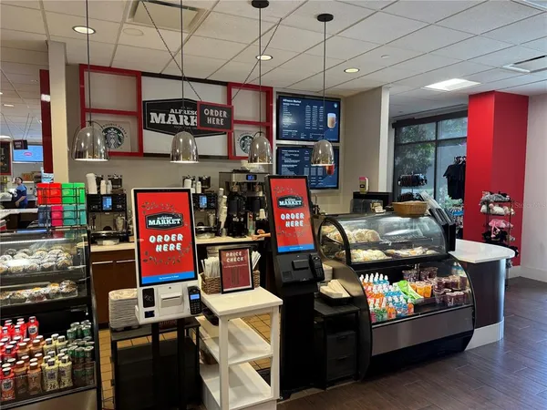 a kitchen with lots of appliances and cabinets