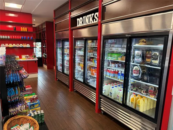 a room with gym equipment and lots of white walls