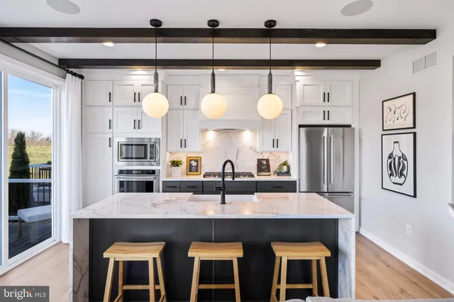 a kitchen with cabinets and window