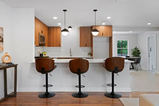 a view of living room with furniture and floor to ceiling window
