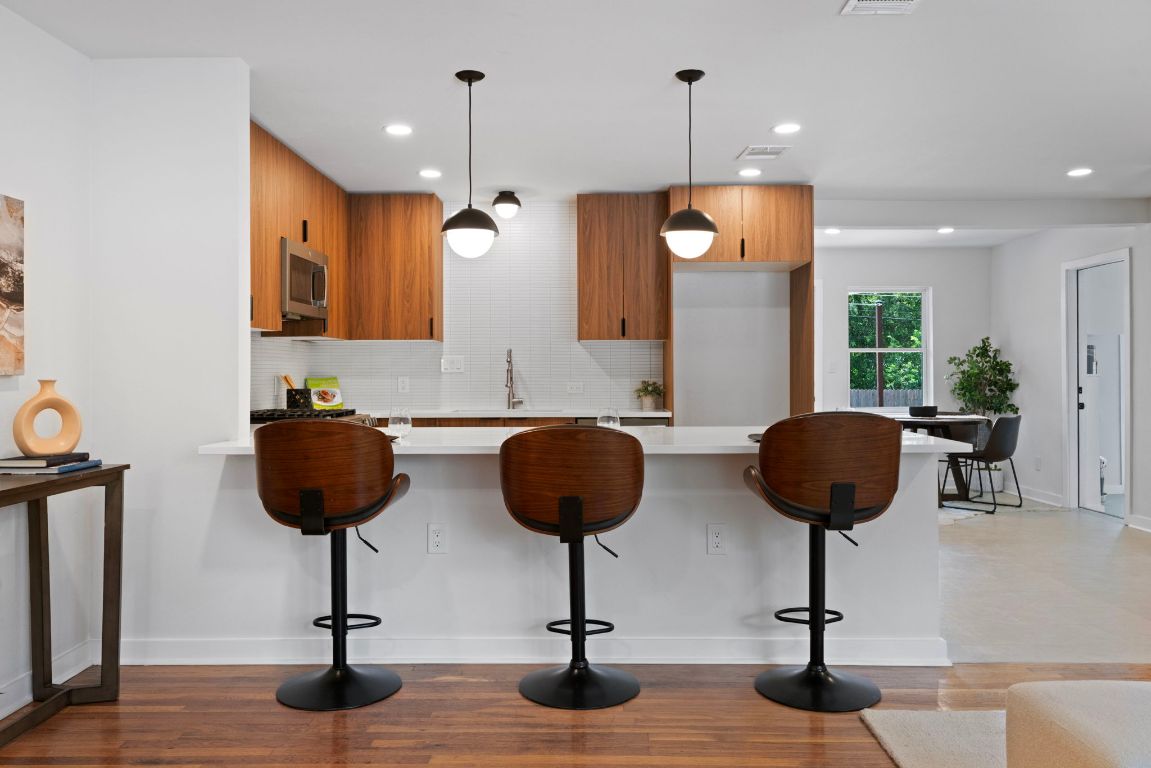 1609 Chatham Avenue Austin, TX 78723 - Photo 12 of 31 a view of kitchen and dining area with chandelier
