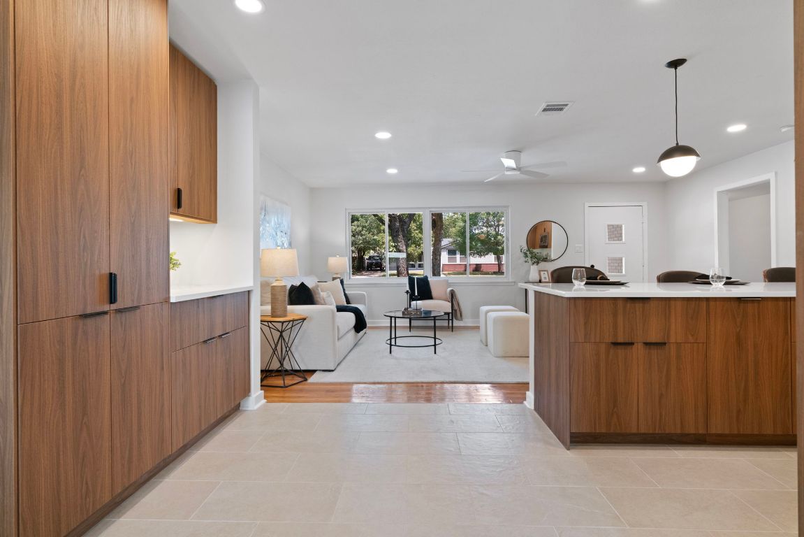 1609 Chatham Avenue Austin, TX 78723 - Photo 17 of 31 a living room with furniture a large window and potted plants