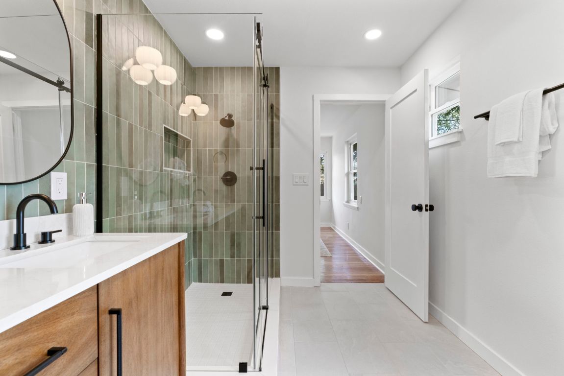 1609 Chatham Avenue Austin, TX 78723 - Photo 21 of 31 a bathroom with a sink a toilet and shower