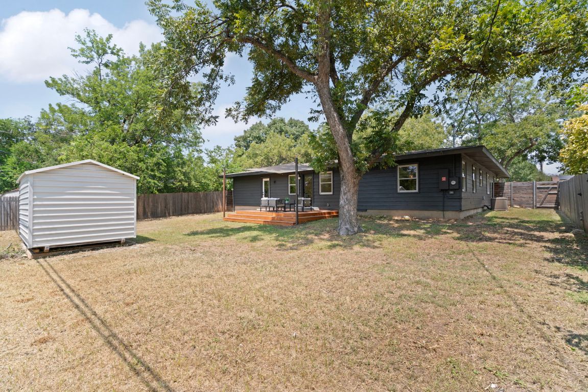 1609 Chatham Avenue Austin, TX 78723 - Photo 29 of 31 a backyard of a house with white floor and tree