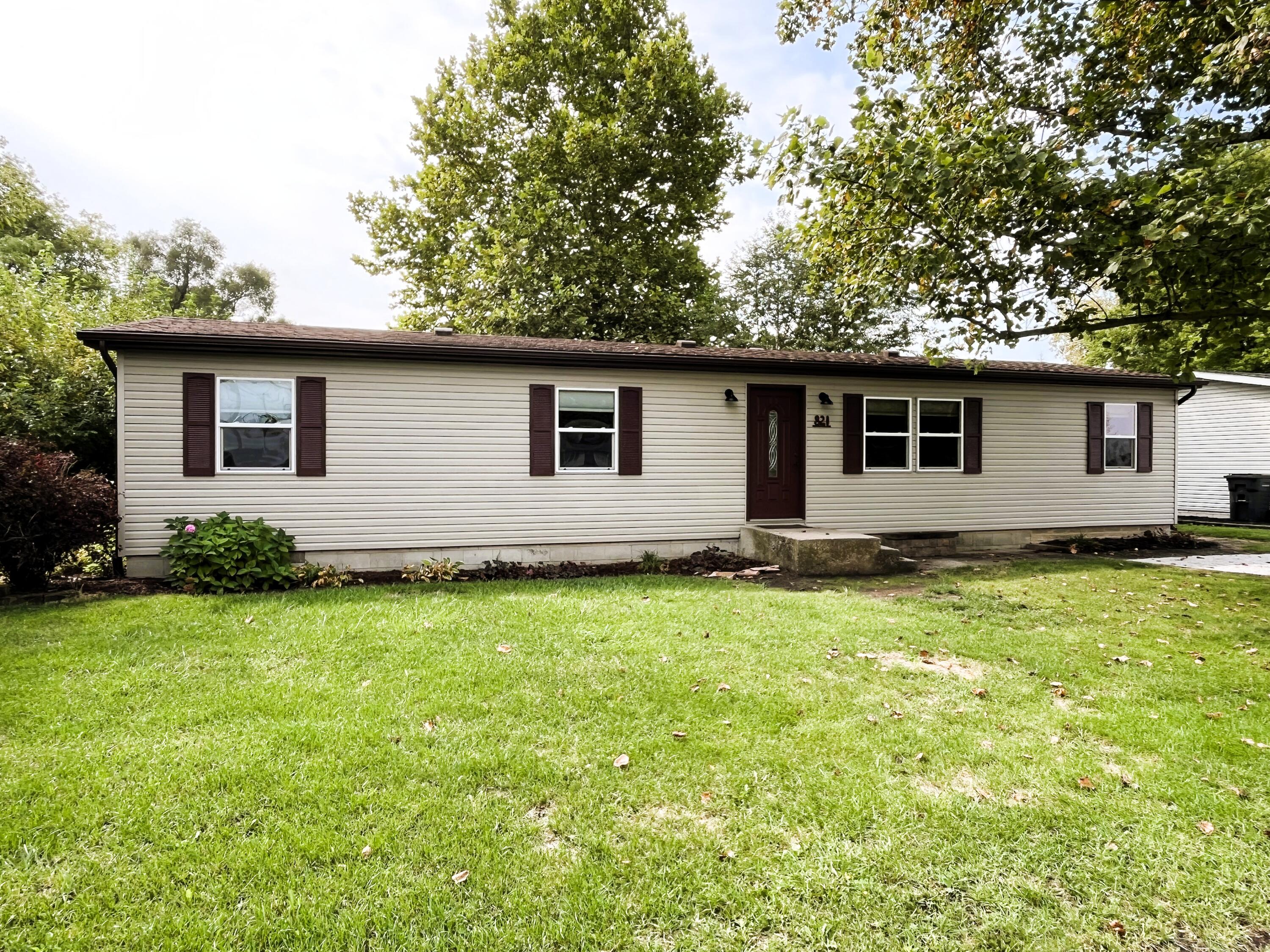 a backyard of a house with seating space