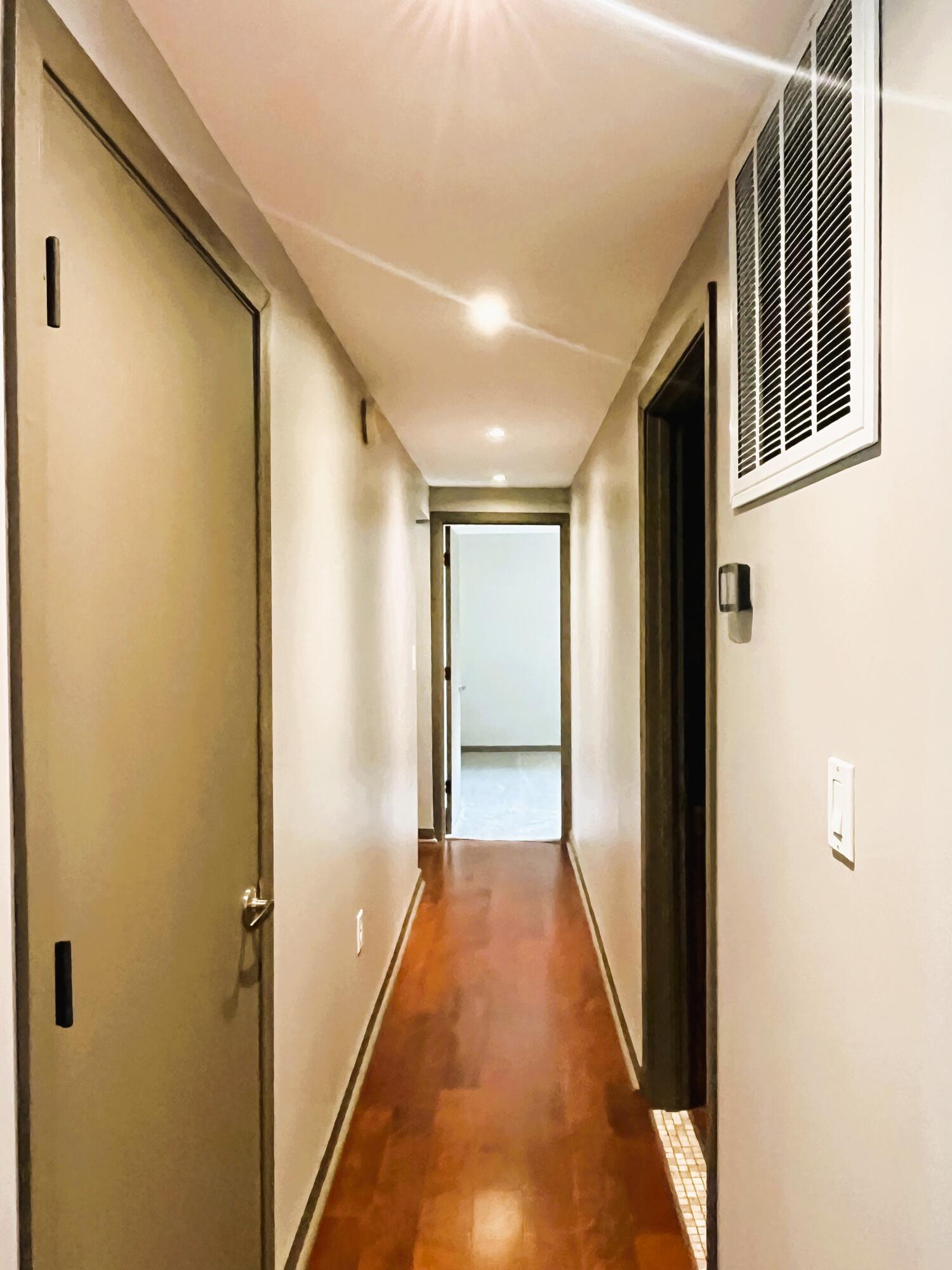 821 East Merritt Street Rensselaer, IN 47978 - Photo 9 of 18 a view of a hallway with wooden floor and staircase