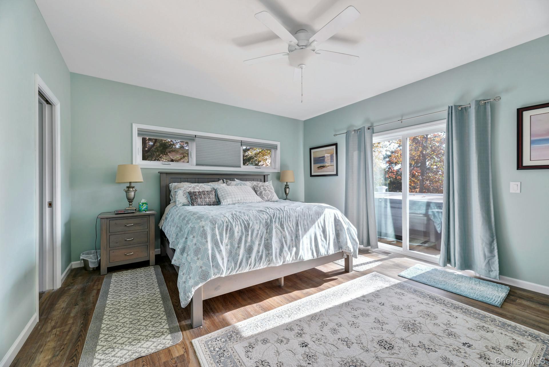 2280 Deep Hole Drive Mattituck, NY 11952 - Photo 22 of 41 a bedroom with a large bed and a window