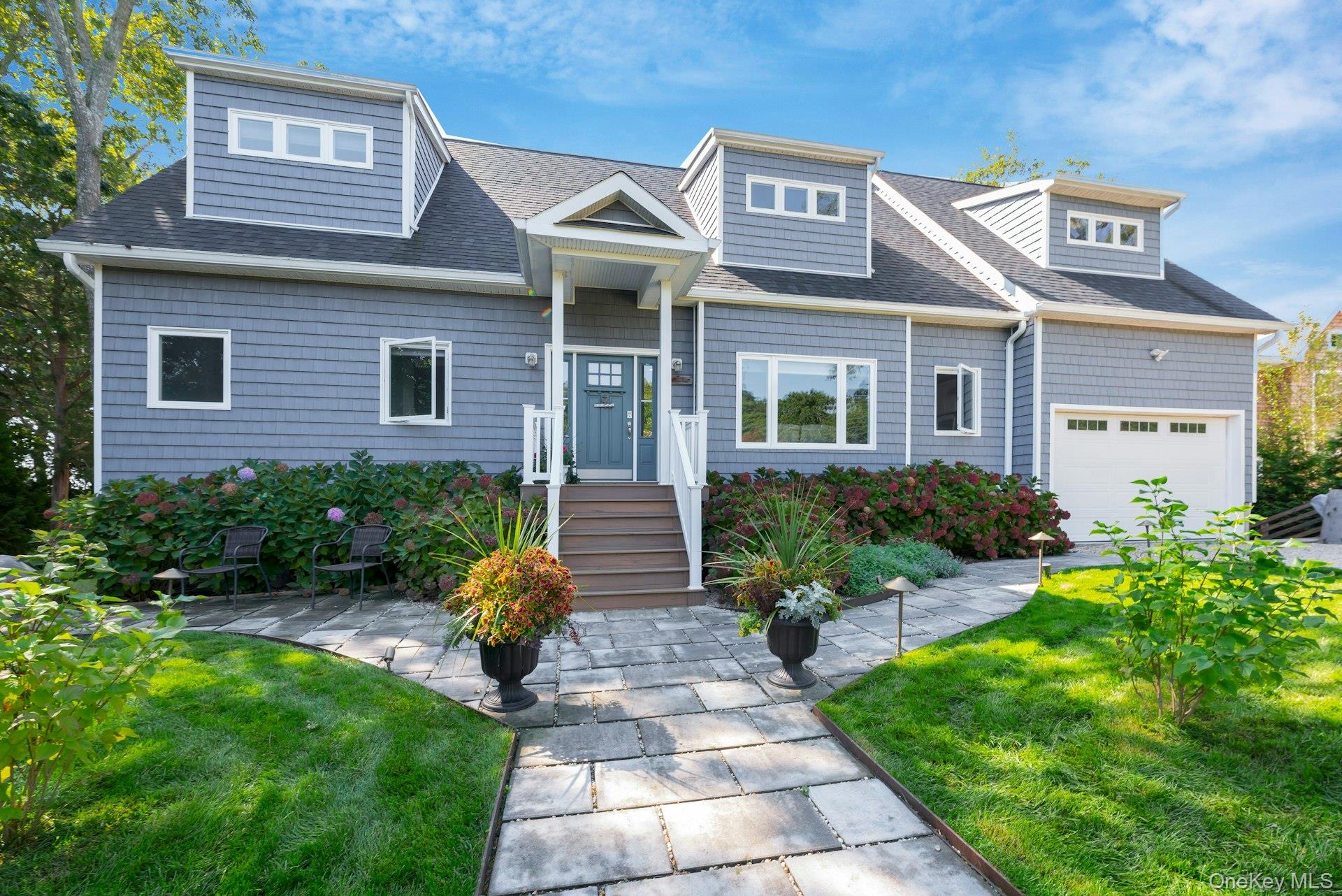 2280 Deep Hole Drive Mattituck, NY 11952 - Photo 29 of 41 a front view of a house with garden