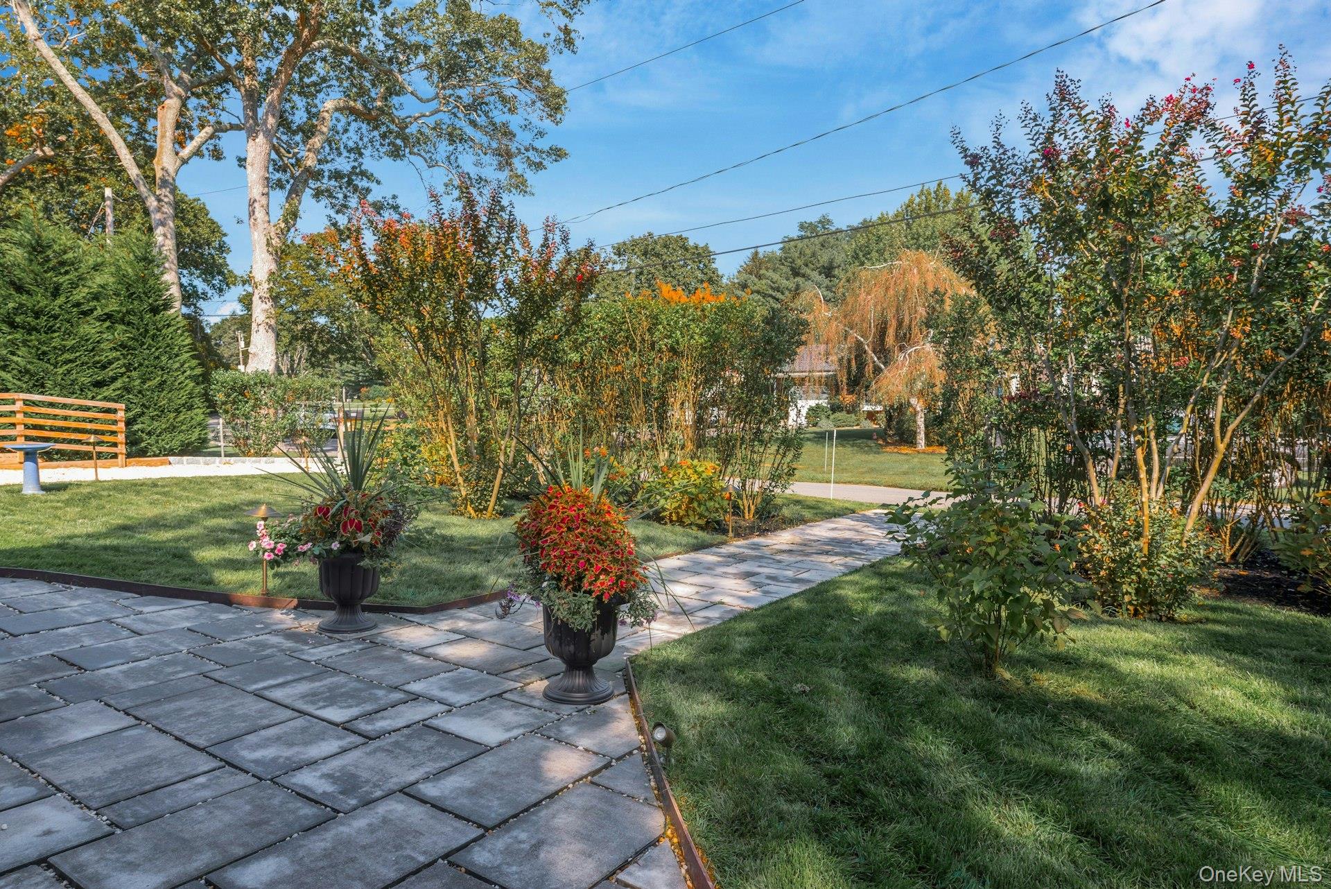 2280 Deep Hole Drive Mattituck, NY 11952 - Photo 30 of 41 a view of a garden with plants and large trees
