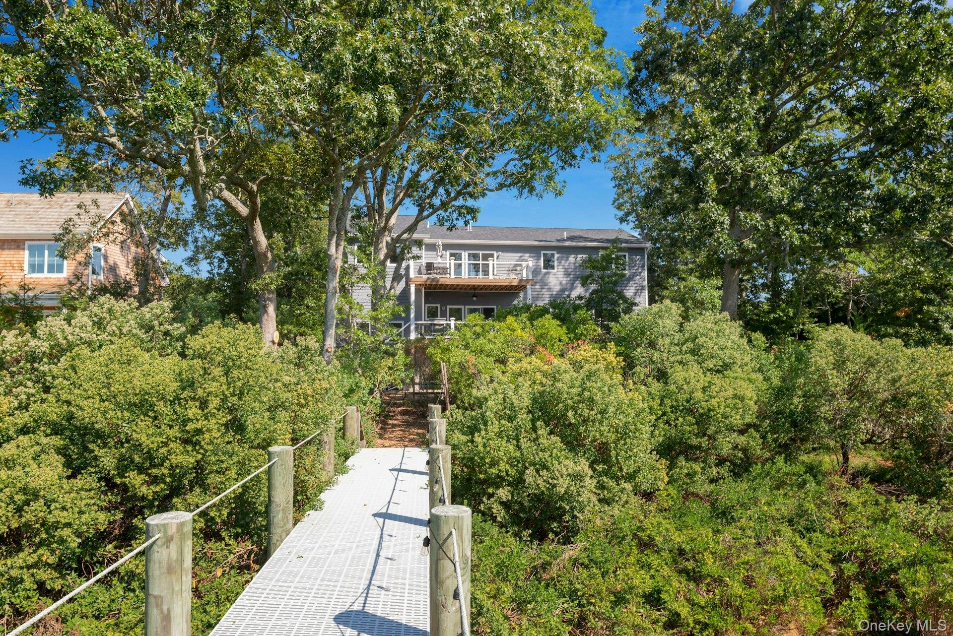 2280 Deep Hole Drive Mattituck, NY 11952 - Photo 34 of 41 a view of a pathway both side of the house