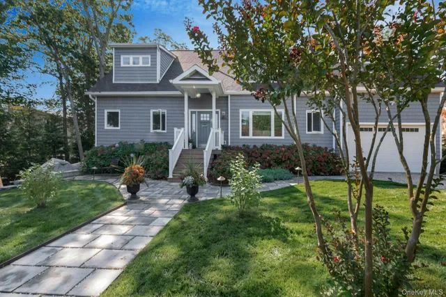a view of backyard of house with green space