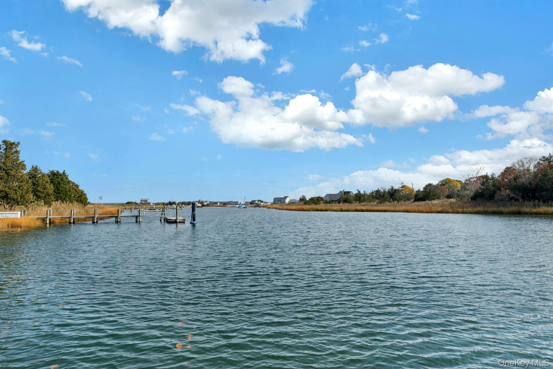 2280 Deep Hole Drive Mattituck, NY 11952 - Photo 6 of 35 A rare waterfront offering where your private deep water dock meets wide open creek with direct access to the Peconic Bay.