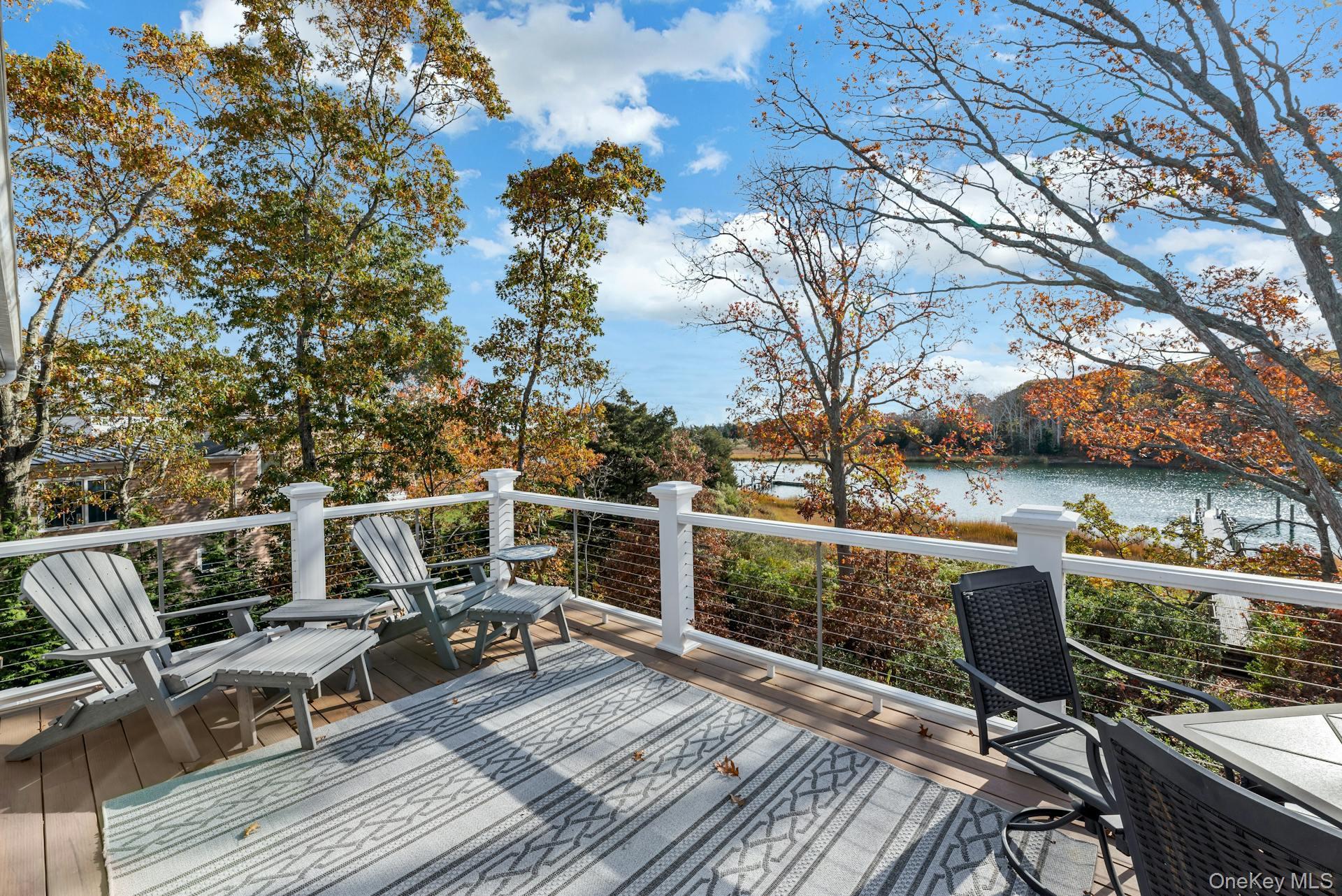 2280 Deep Hole Drive Mattituck, NY 11952 - Photo 7 of 41 a view of balcony with furniture and wooden floor
