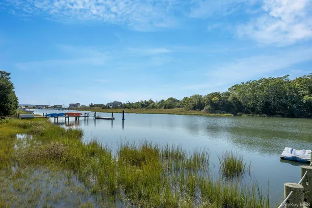 a view of a patio with a table chairs and a backyard