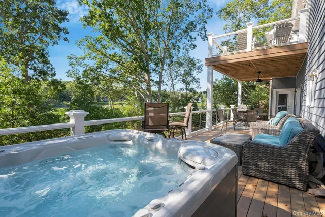 a backyard of a house with lots of green space and a street view