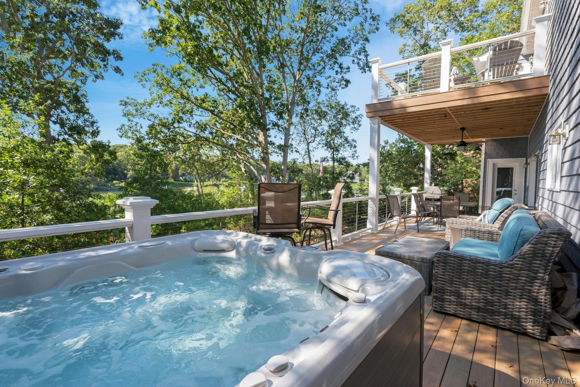 2280 Deep Hole Drive Mattituck, NY 11952 - Photo 10 of 41 a view of a patio with a table chairs and a backyard