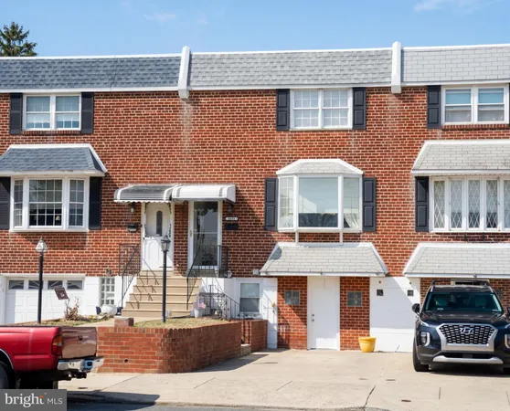 a front view of a house with parking