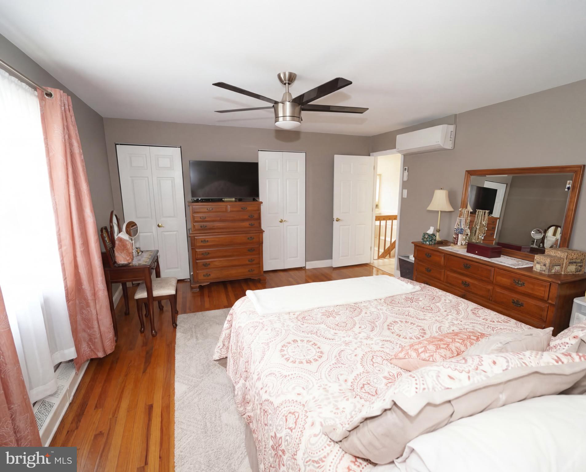 3216 Chesterfield Road Philadelphia, PA 19114 - Photo 18 of 27 a bed room with a bed mirror and a window
