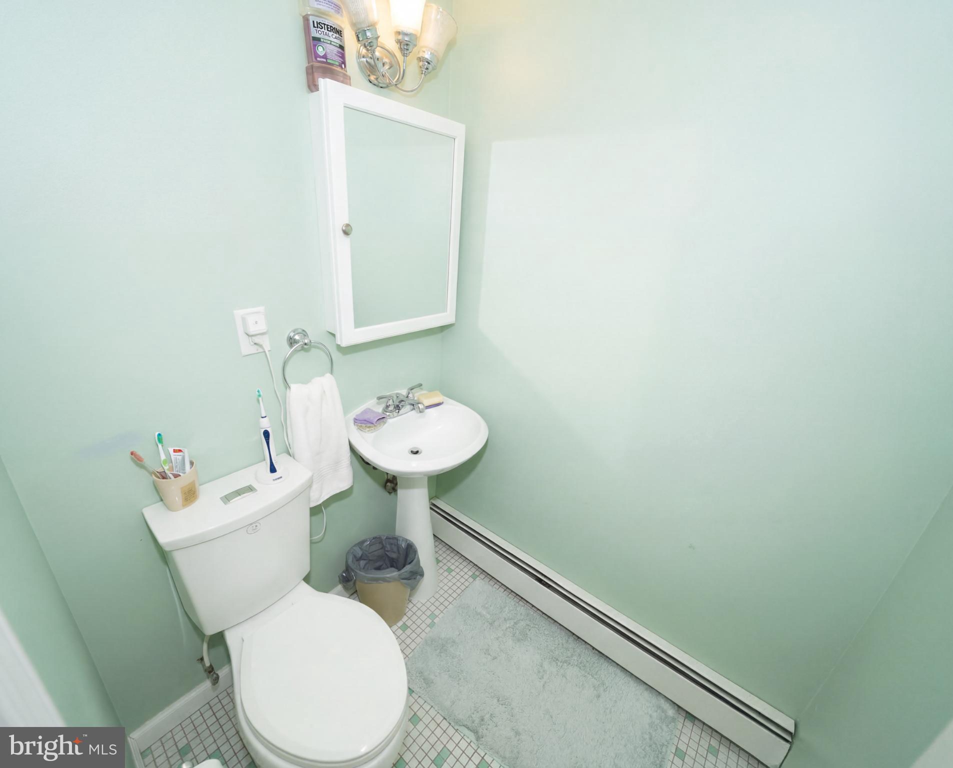 3216 Chesterfield Road Philadelphia, PA 19114 - Photo 19 of 27 a white toilet sitting next to a bathroom sink
