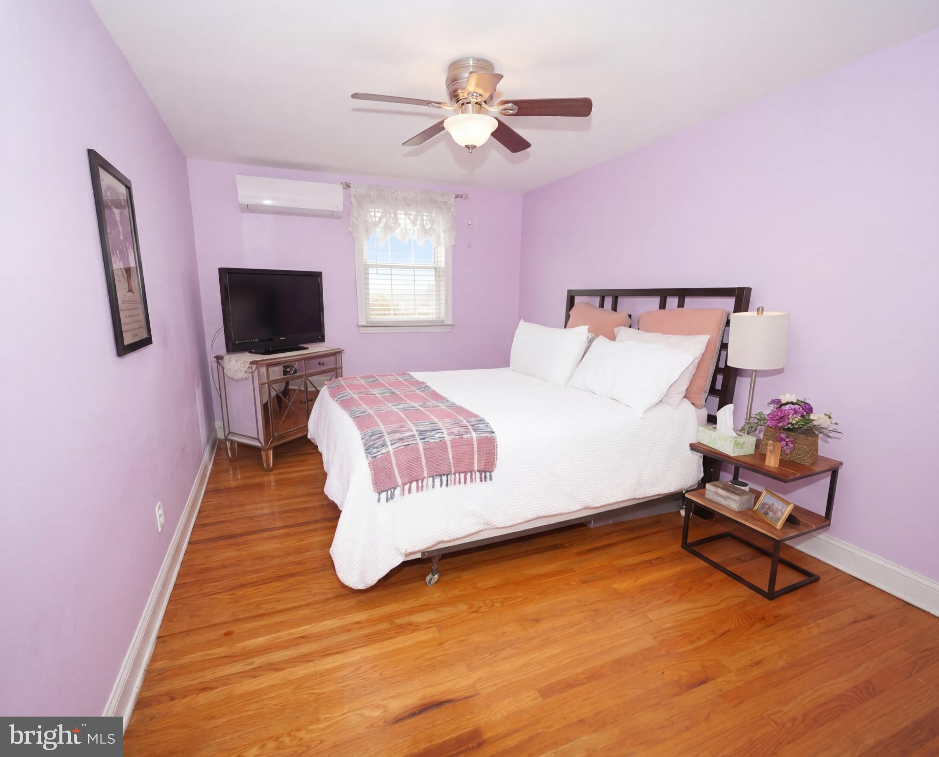 3216 Chesterfield Road Philadelphia, PA 19114 - Photo 22 of 27 a bedroom with a bed and a flat screen tv
