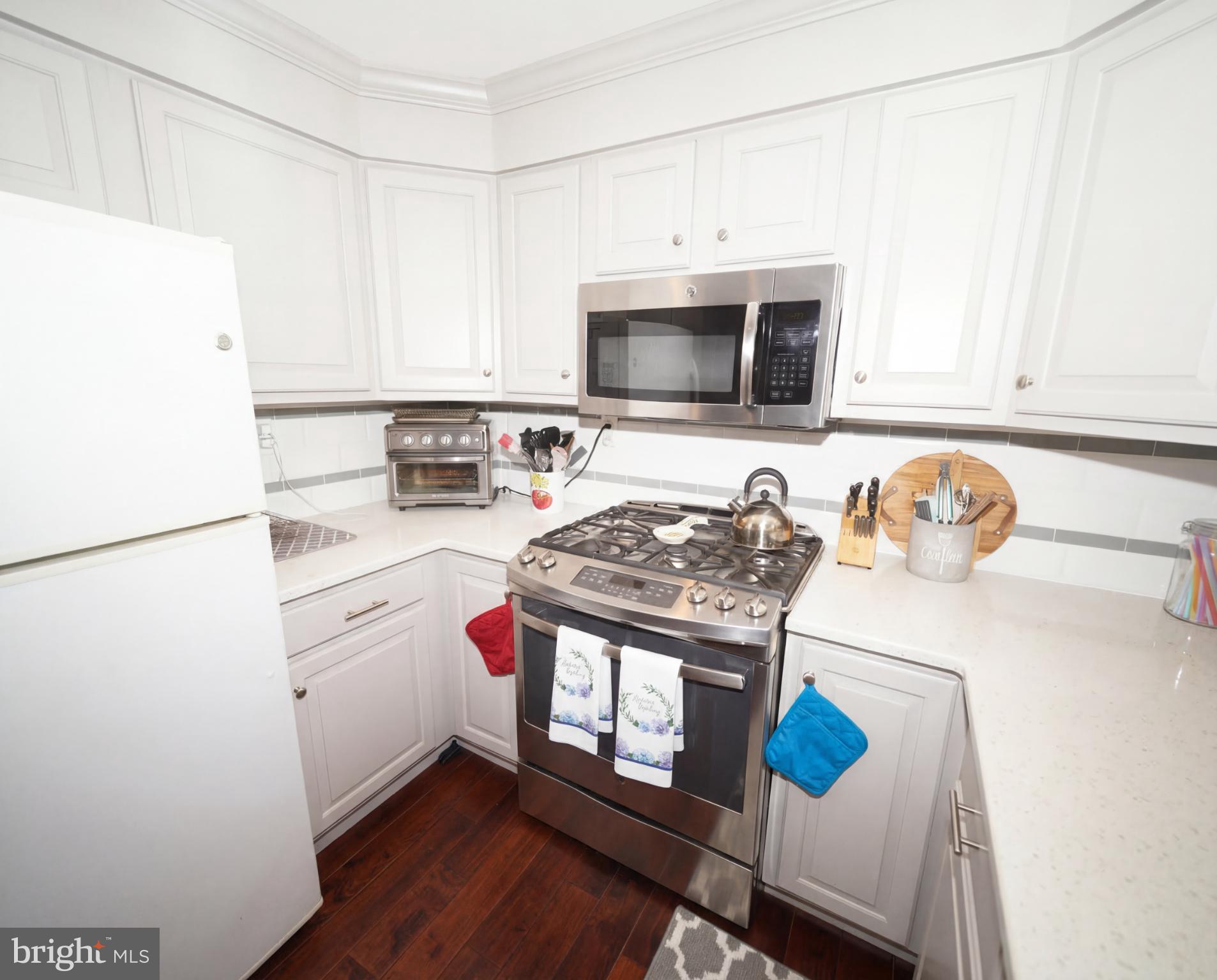 3216 Chesterfield Road Philadelphia, PA 19114 - Photo 10 of 27 a kitchen with stainless steel appliances a stove a sink and a refrigerator