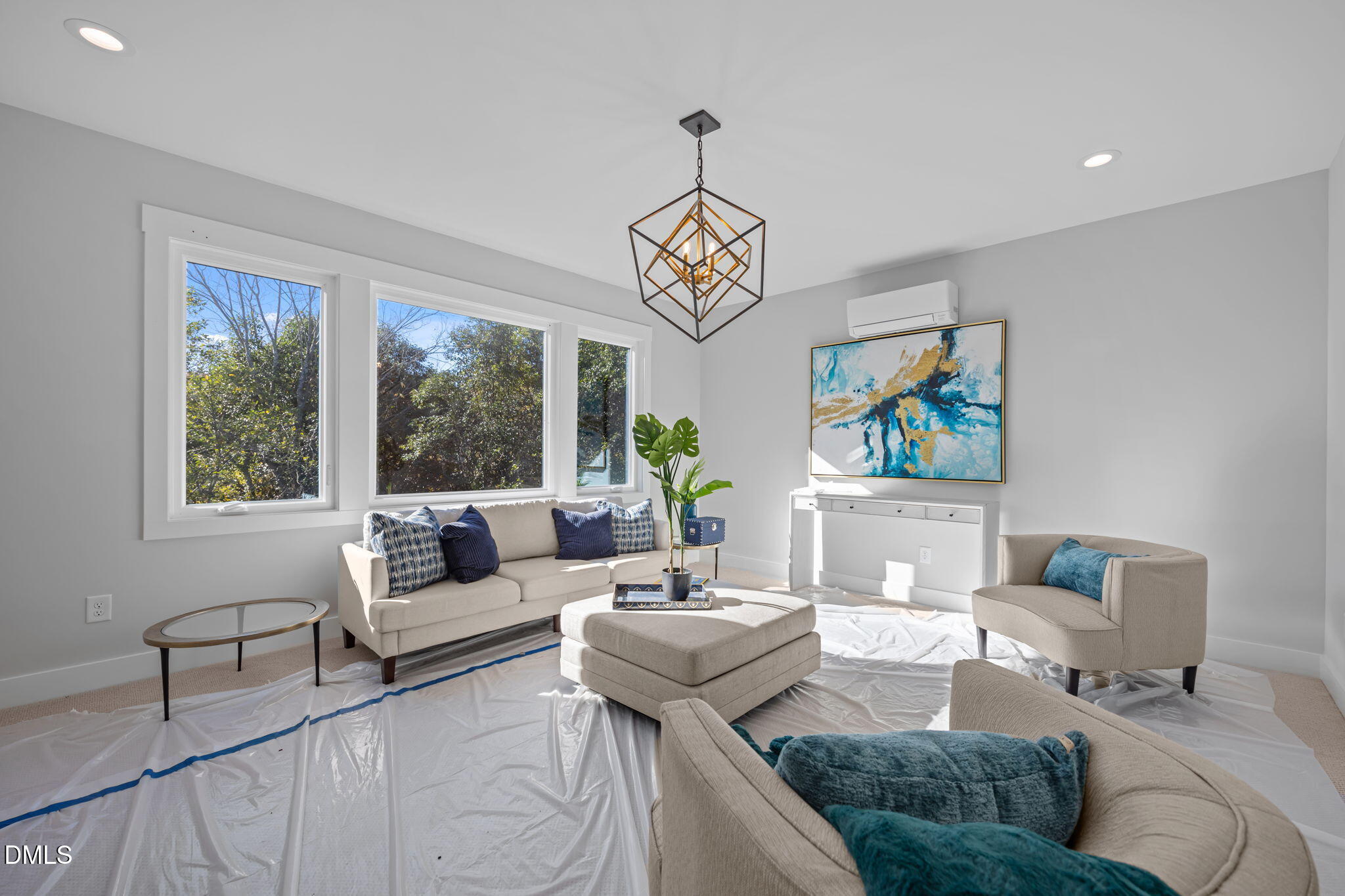 1005 Phoenix Place Raleigh, NC 27610 - Photo 25 of 38 a living room with furniture and a large window