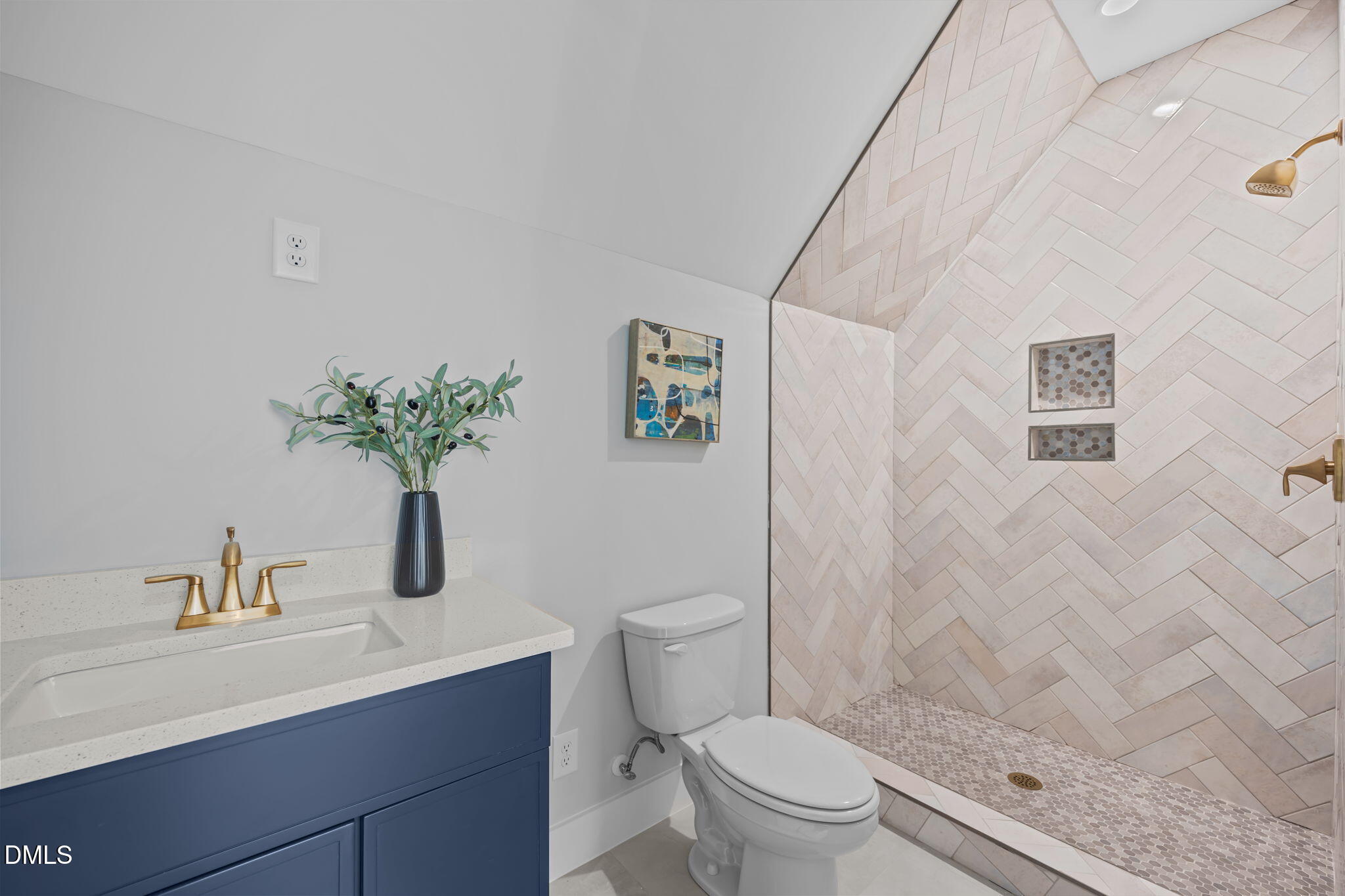 1005 Phoenix Place Raleigh, NC 27610 - Photo 28 of 38 a bathroom with a sink a toilet and shower