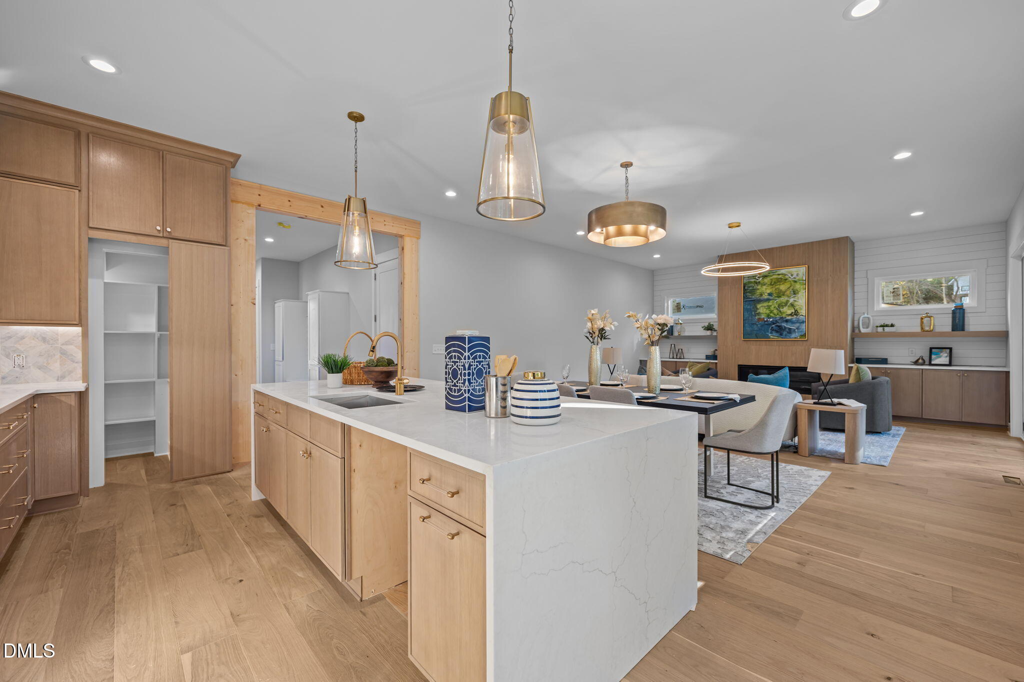 1005 Phoenix Place Raleigh, NC 27610 - Photo 7 of 38 a kitchen with a sink a counter space appliances and cabinets