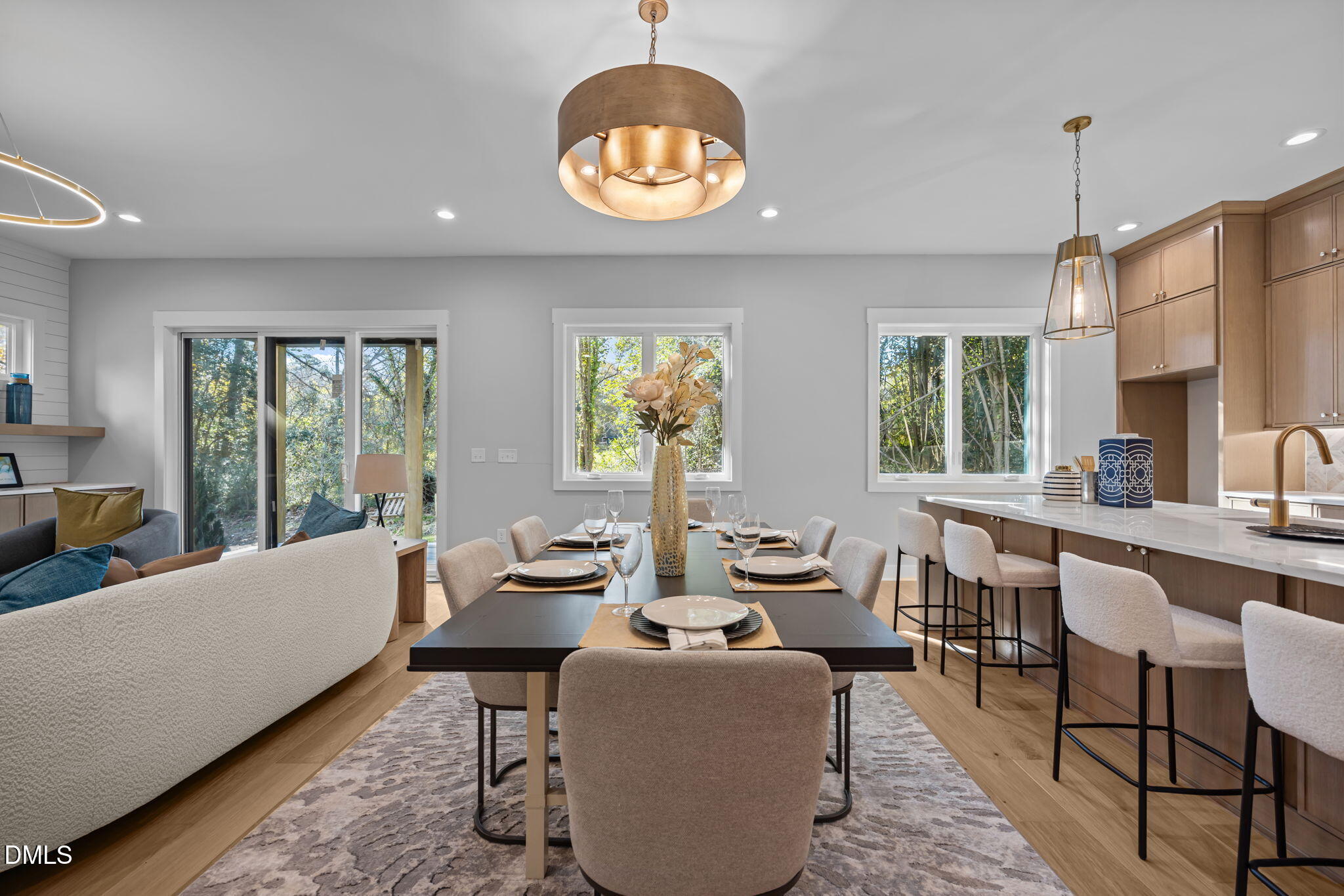 1005 Phoenix Place Raleigh, NC 27610 - Photo 8 of 38 a living room with furniture chandelier and a large window