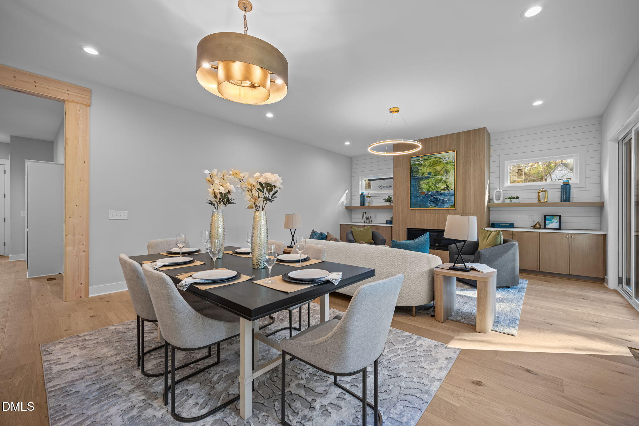 1005 Phoenix Place Raleigh, NC 27610 - Photo 9 of 38 a view of a dining room with furniture a chandelier and wooden floor