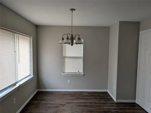 a room with window and wooden floor