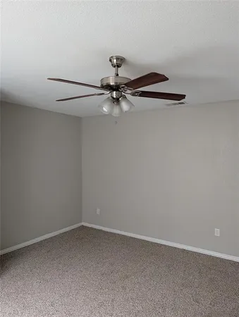 a view of a small space with a fan