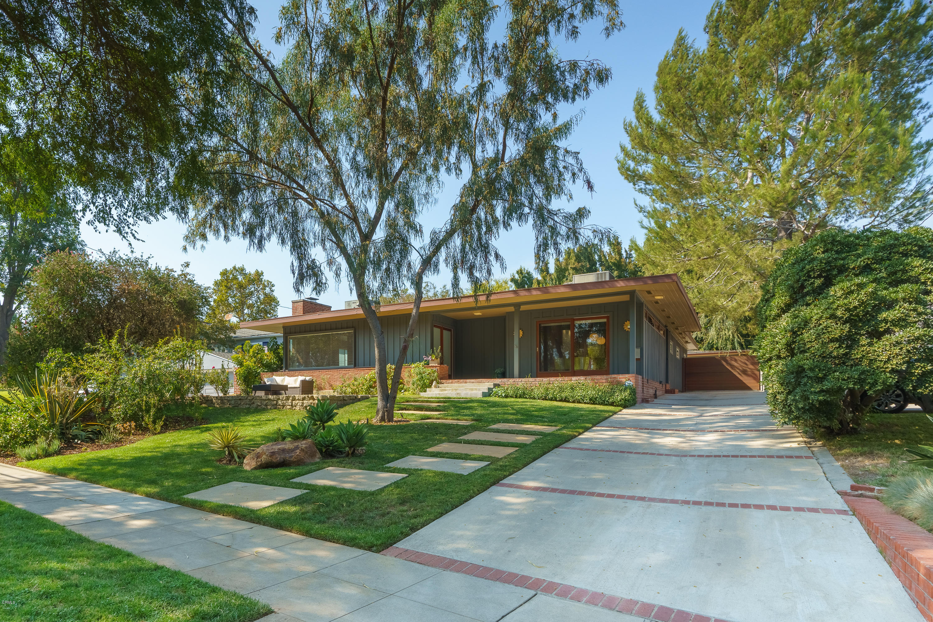 1025 Nithsdale Road Pasadena, CA 91105 - Photo 1 of 34 a front view of a house with a yard and trees