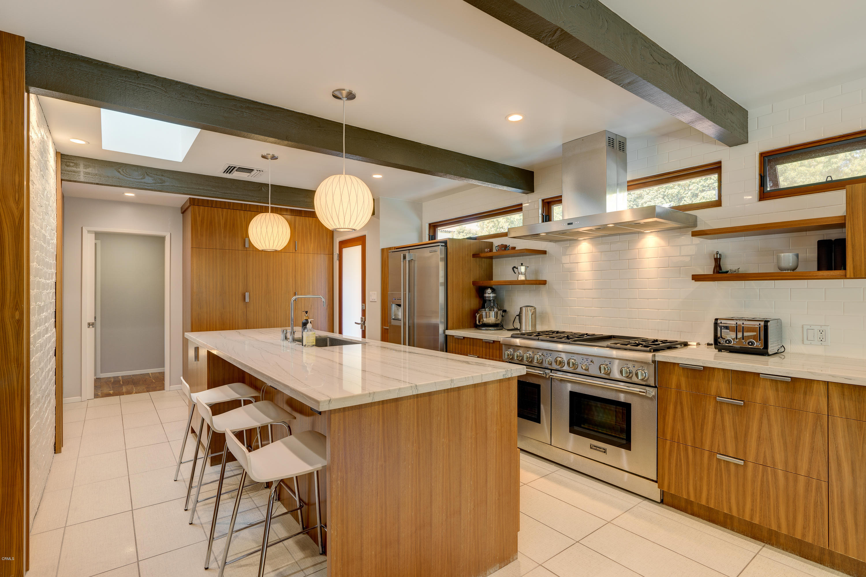 1025 Nithsdale Road Pasadena, CA 91105 - Photo 12 of 34 a kitchen with a stove a sink and a refrigerator