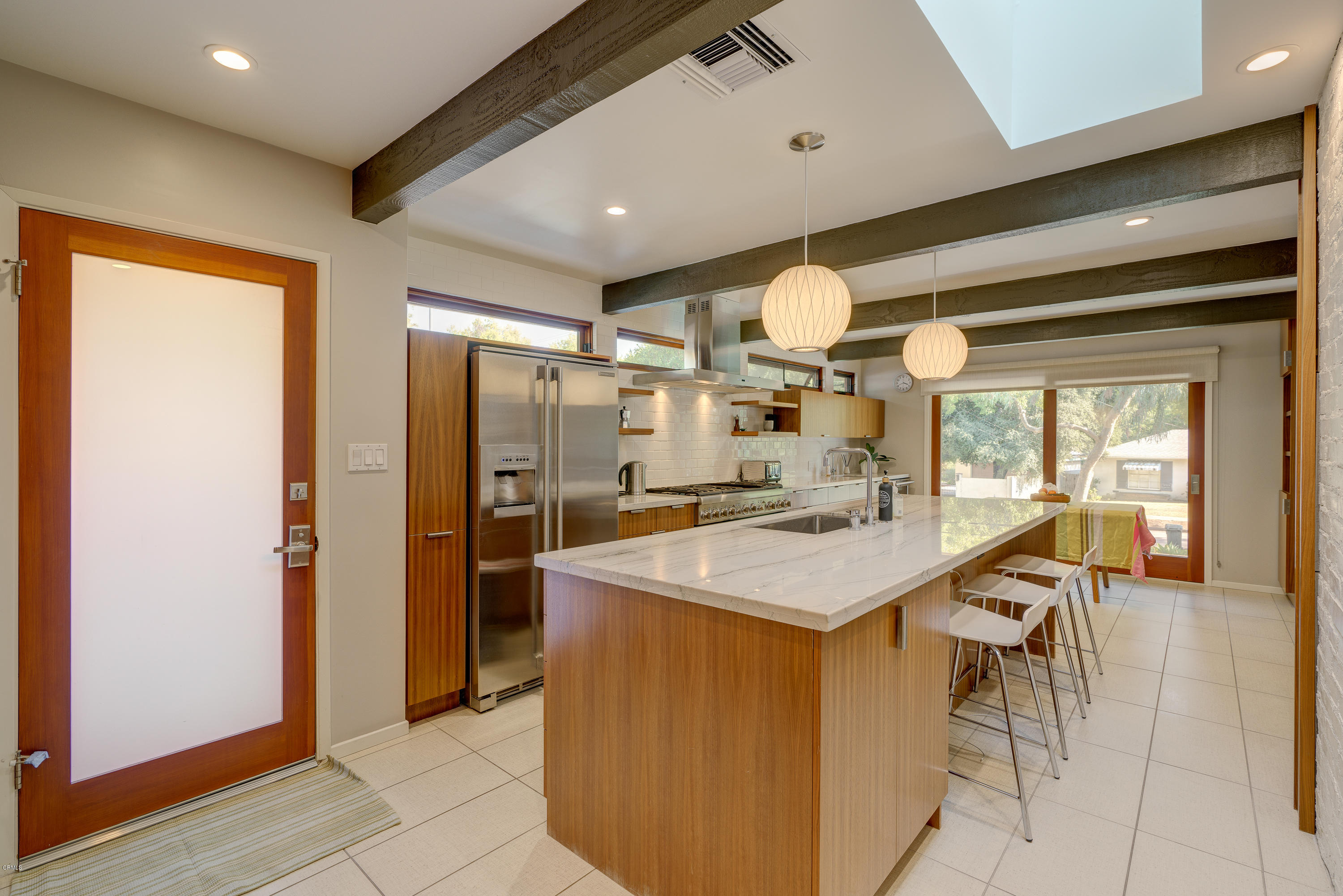 1025 Nithsdale Road Pasadena, CA 91105 - Photo 13 of 34 a large kitchen with a table and chairs
