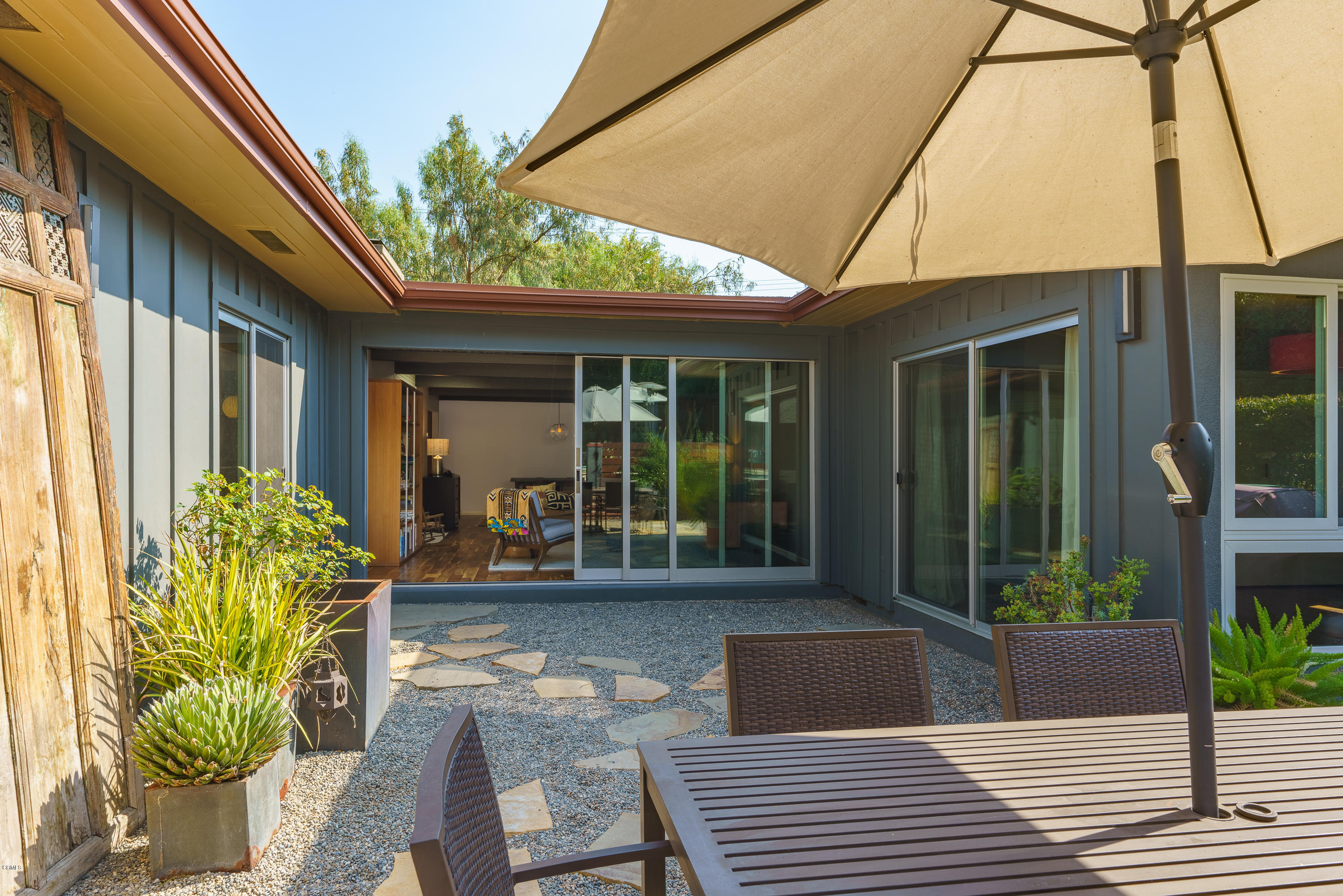 1025 Nithsdale Road Pasadena, CA 91105 - Photo 24 of 34 a house with potted plants in front of it