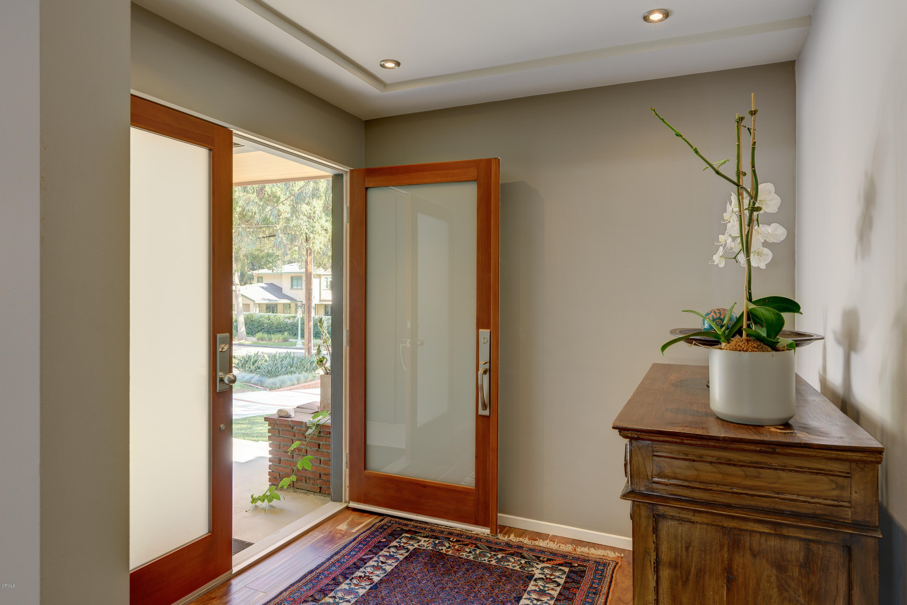 1025 Nithsdale Road Pasadena, CA 91105 - Photo 4 of 34 a potted plant sitting on a table next to a window